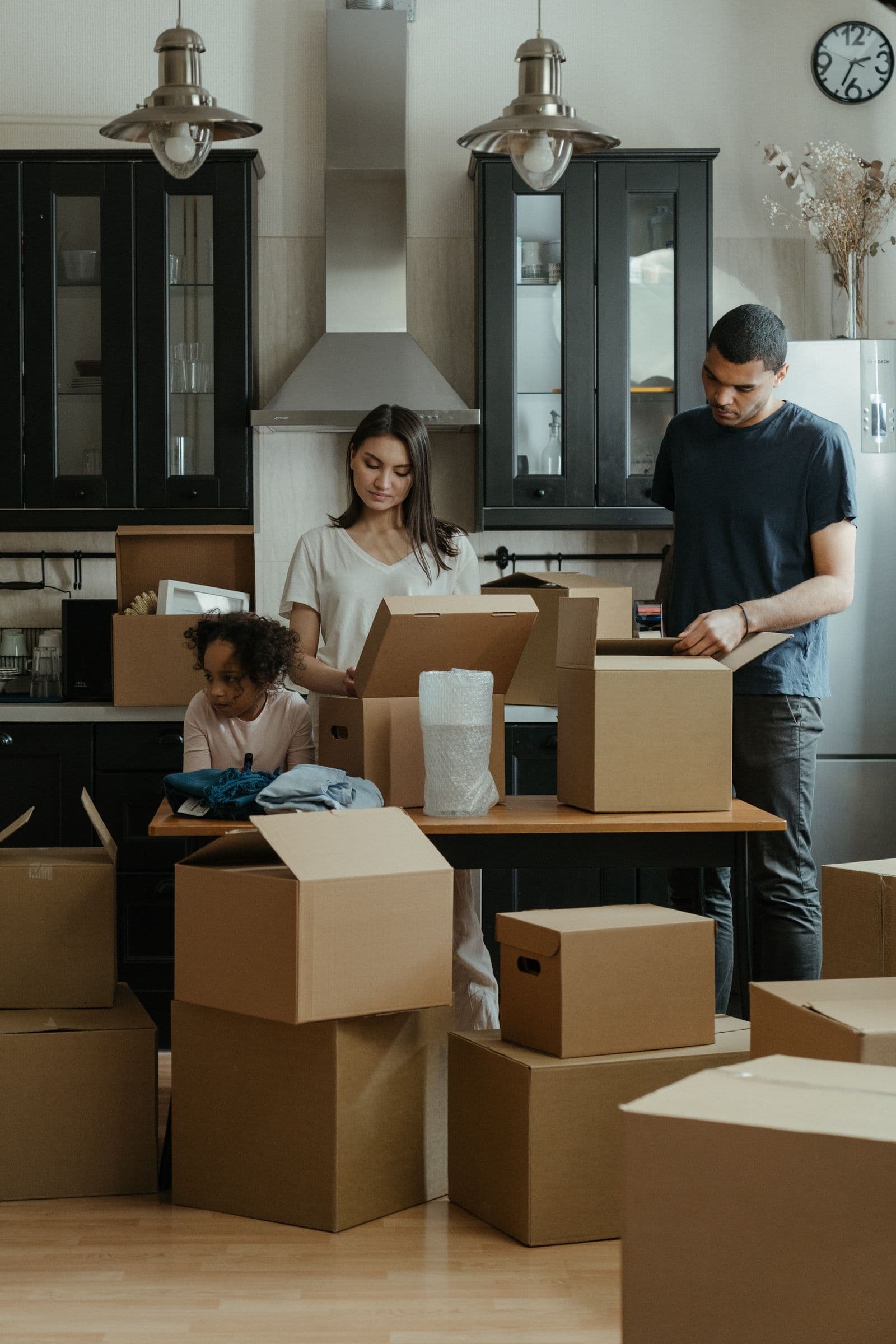 Family unpacking in their new kitchen