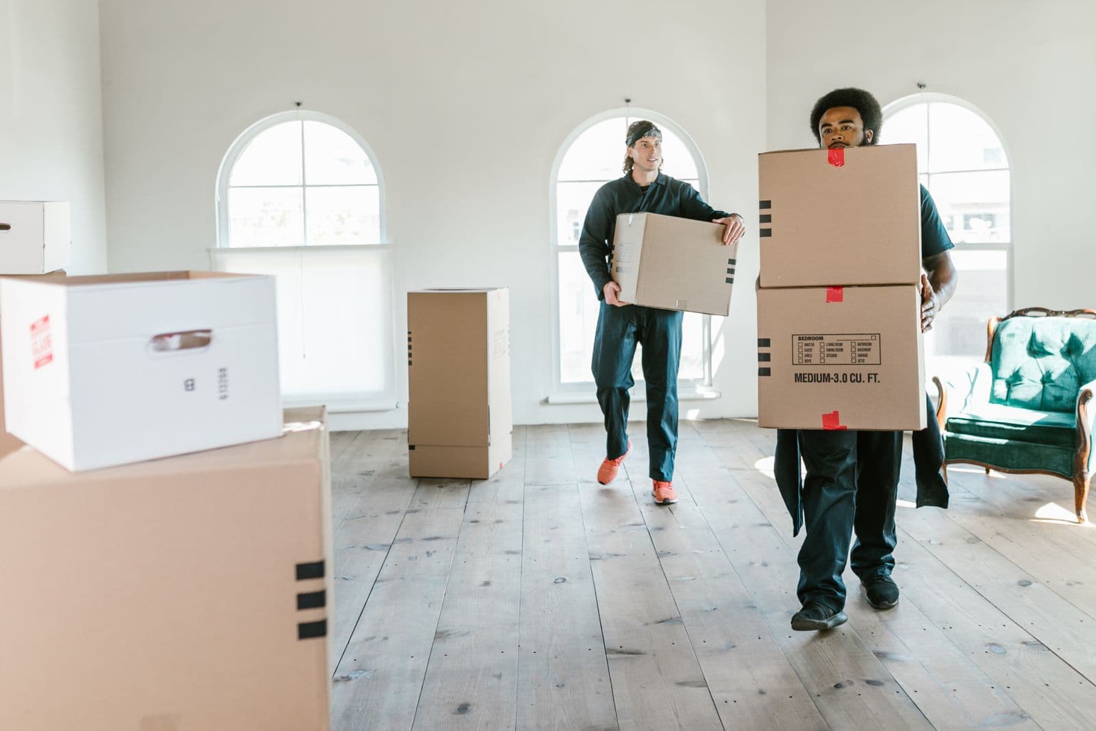 Movers carrying boxes